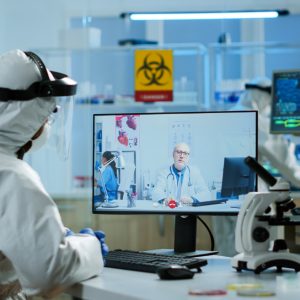 chemist-ppe-suit-listening-professional-doctor-video-call-discussing-during-virtual-meeting-research-laboratory-doctors-using-high-tech-researching-treatment-against-covid19-virus